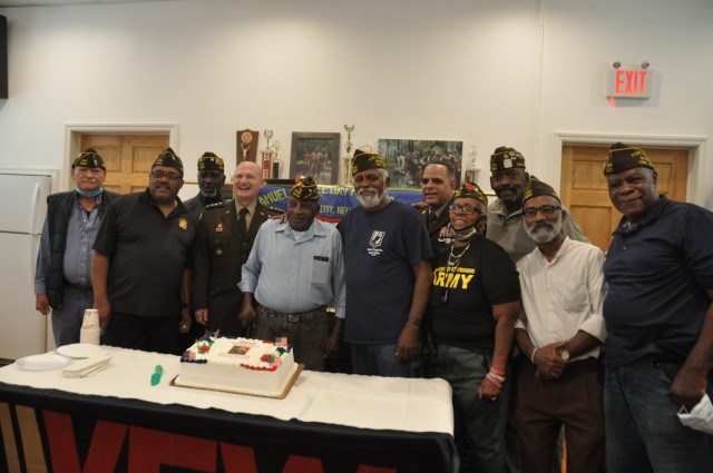 Army Materiel Command’s Gen. Ed Daly and Command Sgt. Maj. Alberto Delgado join members of the Veterans of Foreign Wars Samuel R. Shelton Post 2294 in Jersey City, New Jersey, to cut a cake celebrating Daly’s visit to the post. It is the last...