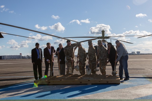Distinguished guests and military leaders break ground at Hunter Army Airfield, Georgia, during a ceremony on Oct. 29. The ceremony marks the building of a new hangar on the installation for the 3rd Combat Aviation Brigade. (U.S. Army photo by Sgt. Andrew McNeil / 3rd Combat Aviation Brigade, 3rd Infantry Division)