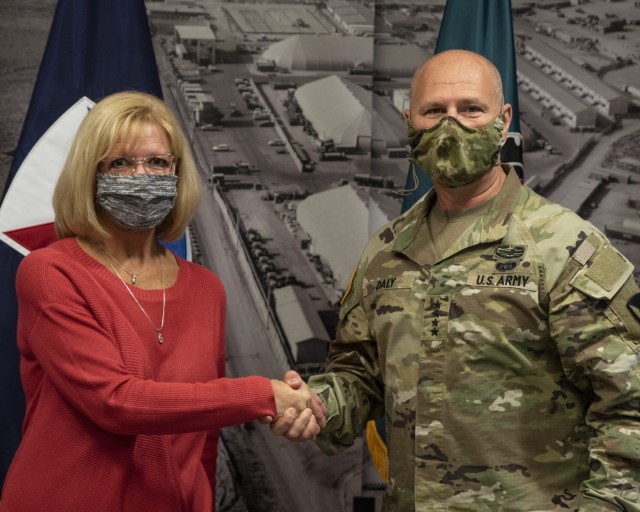 Gen. Ed Daly, commanding general of the U.S. Army Materiel Command, congratulates Mary Ann Wicks after presenting her with a commander’s coin for her work on promoting resilience in the ASC workforce during the coronavirus pandemic. Daly made...