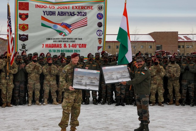 Col. Jody Shouse, commander, 4th Infantry Brigade Combat Team (Airborne), 25th Infantry Division, “Spartan Brigade,” and Indian Army Brigadier Parag Nangare, exercise director and commander of 136 (I) Infantry Brigade Group exchange commemorative photos Oct 29 as a part of the conclusion to Yudh Abhyas 21 on Joint Base Elmendorf-Richardson. Yudh Abhyas is a bilateral training exercise aimed at improving the combined interoperability of the Indian army and U.S. Army Alaska to increase partner capacity for conventional, complex and future contingencies throughout the Indo-Pacific region. (Photos provided by Sgt. Christopher B. Dennis/USARAK Public Affairs NCO)