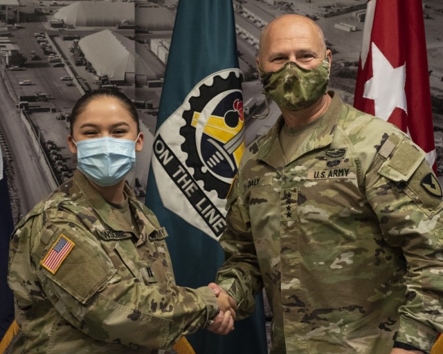 Gen. Ed Daly, commanding general of the U.S. Army Materiel Command, congratulates Capt. Sarah Newsome after presenting her with a commander’s coin for her work on developing a talent management initiative in support of the recent ASC Senior...