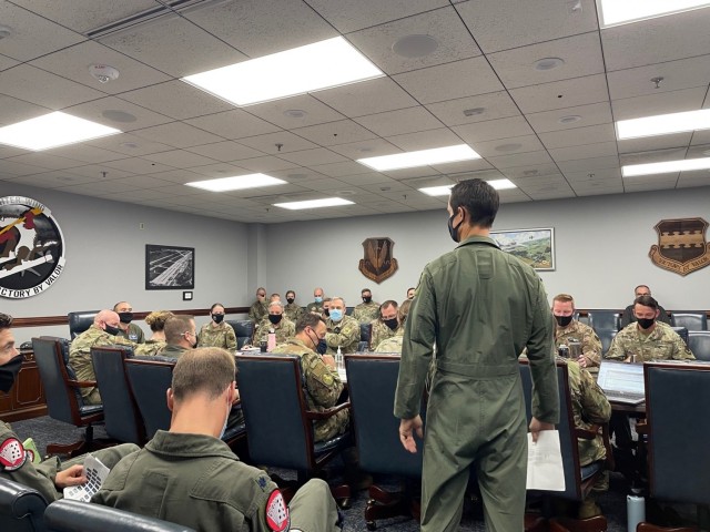Maj. Matthew Feeman, 20th Fighter Wing ACE lead, briefs the 20th FW commander on the first ACE command and control vignette where the team was solving a problem regarding prioritization of sortie support.  The 505th CCW’s ACE training team provided academics, guided discussions, and table-top exercise allowing the 20th FW leadership to solve real-world problems under the mentoring and instruction of the 505th’s C2 subject matter experts.  The C2 lessons prepared the 20th FW and their expeditionary fighter squadron to execute wing-level Exercise IRON HAND.  (U.S. Air Force photo)