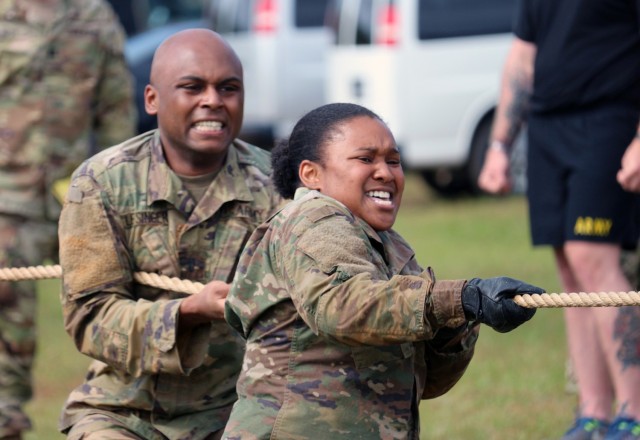 Competitors strain and pull for their team in the tug of war competition during the 1st Cyber Battalion "mungadai" 24-hour challenge, at Fort Gordon, Ga., Oct. 22, 2021. (Photo by Bill Roche)