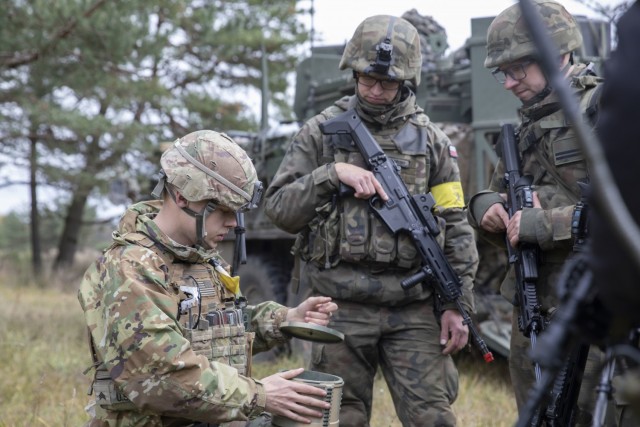 U.S. Army Sgt. James Wright, a combat engineer assigned to 3rd Battalion, 161st Infantry Regiment, teaches Polish Territorial Defense Force soldiers how to utilize soft demo explosively formed projectiles during Rifle Focus on Oct. 16, 2021 in Bemowo Piskie Training Area. This demonstration was one of many opportunities NATO allies had to work together and learn from each other during Rifle Focus, enhancing interoperability. (U.S. Army photo by Spc. Jameson Harris)