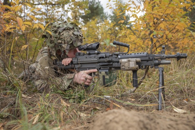 U.S. Army Spc. Michael Schwader, a Soldier assigned to 3rd Battalion, 161st Infantry Regiment, pulls security during Rifle Focus, with a M240B machine gun, in Bemowo Piskie Training Area Oct. 16, 2021. Different companies competed against each other as part of Rifle Focus, Battle Group Poland’s two-week long capstone maneuver exercise. (U.S. Army photo by Spc. Jameson Harris)
