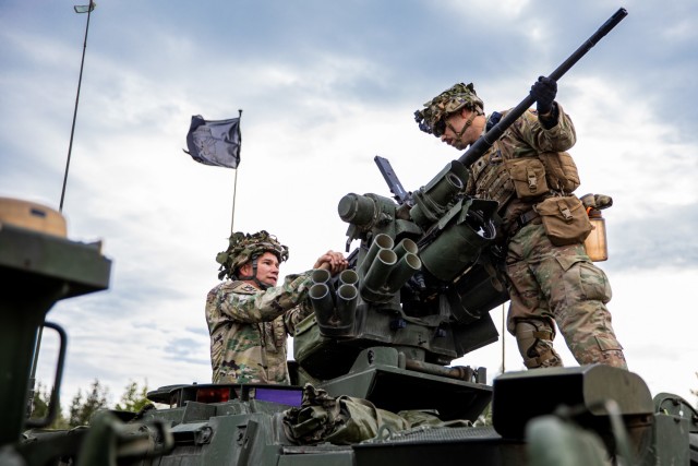 U.S. Army Soldiers from 3rd Battalion, 161st Infantry Regiment prepare a .50 caliber M2 machine gun on a Stryker during Rifle Focus at Bemowo Piskie Training Area, Poland, October 6, 2021. Rifle Focus is a force-on-force U.S.-led training exercise that involves allies from Battle Group Poland, supporting two U.S. infantry companies. This exercise measures command and control and maneuver tactics to support the NATO alliance. (U.S. Army photo by Spc. Osvaldo Fuentes)