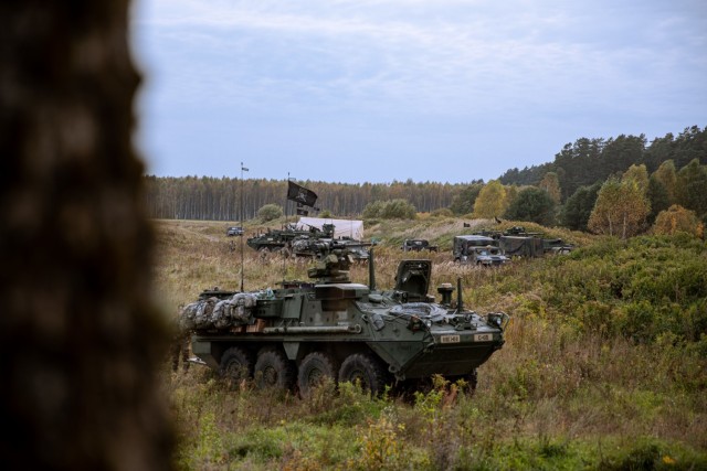 U.S. Army military vehicles with 3rd Battalion, 161st Infantry Regiment, take defensive positions during Rifle Focus at Bemowo Piskie Training Area, Poland, October 6, 2021. Rifle Focus is a force-on-force U.S.-led training exercise that involves allies from Battle Group Poland, supporting two U.S. infantry companies. This exercise measures command and control and maneuver tactics to support the NATO alliance. (U.S. Army photo by Spc. Osvaldo Fuentes)