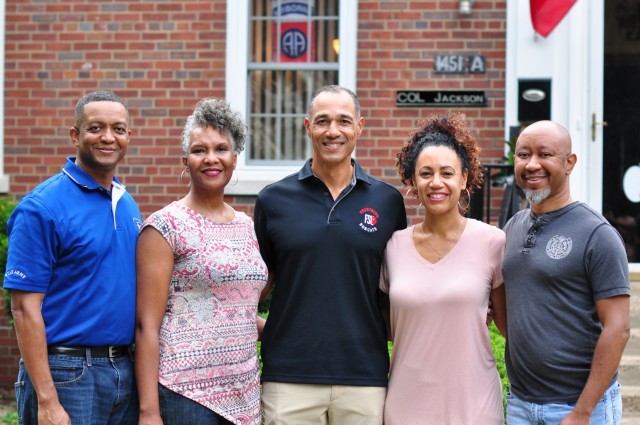 Col. Eric Jackson, his wife, Tonya Jackson, Maj. Gen. Robert Edmonson II, his wife, Ellen Edmonson and Brian Jackson meet in-person for the first time as a family on Fort Knox, Kentucky.