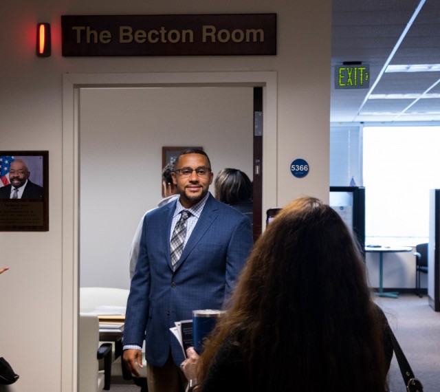 Don Edward Becton Jr. is framed in the doorway of The Becton Room in U.S. Army Aviation and Missile Command G-8 area Oct. 29 at Redstone Arsenal, Ala. The room was named in honor of his father, Don Edward Becton Sr., who was the AMCOM Command Audit Readiness Office chief at the time of his death.