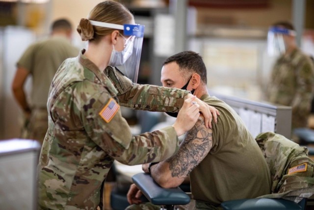 Army medic vaccinates Soldier against COVID-19