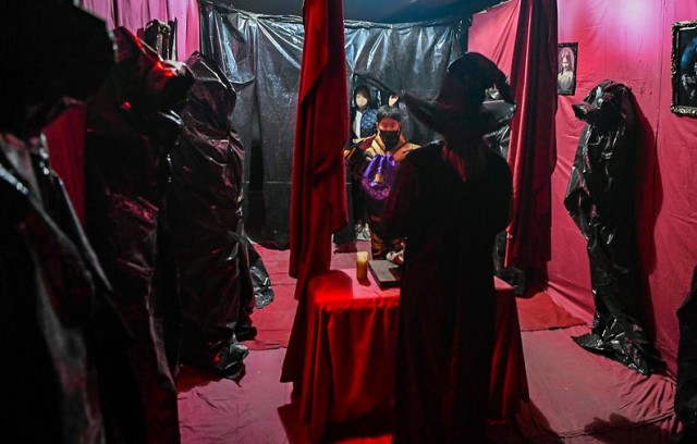 Participants enter one of the rooms in the House of Fears haunted house during the Camp Humphreys Halloween Spooktacular at Sitman Gym parking garage Oct. 30, 2021. (U.S. Army photo by Spc. Brooke Davis)