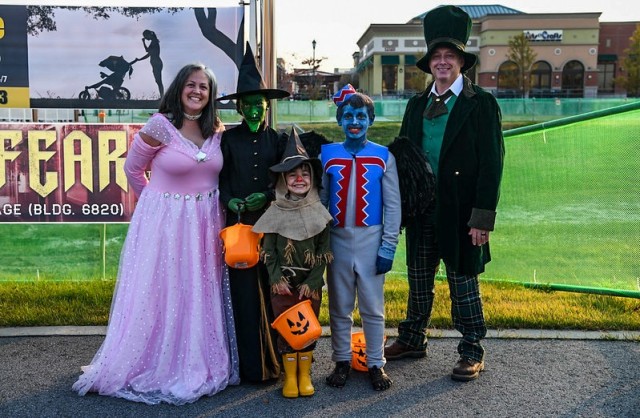 Roy Tongue, assigned to the U.S. Army Corps of Engineers, poses with his family during the Camp Humphreys Halloween Spooktacular Trunk or Treat Oct. 30, 2021. The Tongue family took home the award for best family costume for dressing as characters from “The Wizard of Oz.” (U.S. Army photo by Spc. Brooke Davis)