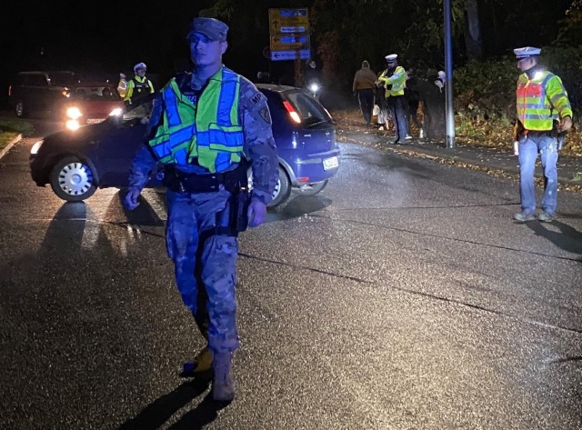 USAG Wiesbaden military police and Wiesbaden Polizei work together to monitor housing access as COVID rules and regulations imposed a reduced Halloween celebration on Sunday, Oct. 31, 2021.