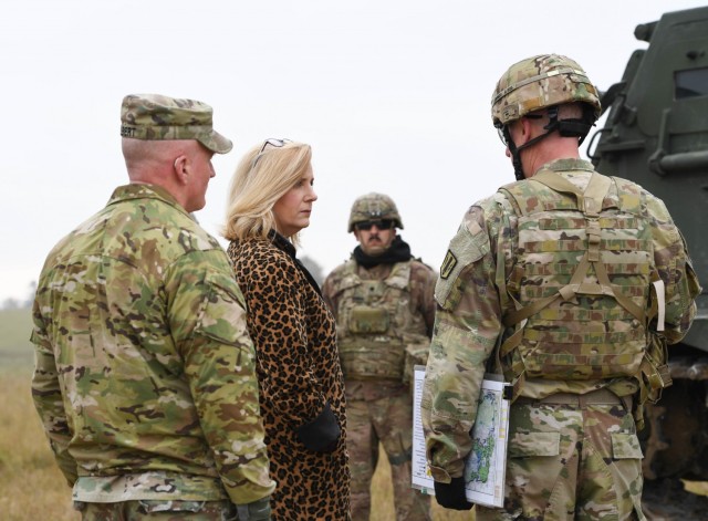 Secretary of the Army Christine Wormuth discusses lessons learned on newly fielded equipment with 41st Artillery Brigade in Grafenwohr, Germany, Oct. 27, 2021. Wormuth met with Soldiers from the 173rd Airborne Brigade, 2nd Cavalry Regiment, and the 41st Artillery Brigade and shared how training with allies and partners improves NATO interoperability. (U.S. Army photo by Staff Sgt. Keisha Brown)