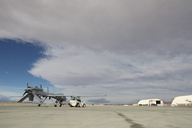 An MQ-1C Gray Eagle with Fox Company, 1st Attack Battalion, 1st Combat Aviation Brigade, is taxied off the runway due to high winds predicted throughout the day during the Maneuver Warfare Exercise (MWX), at Twentynine Palms, California, on Oct....