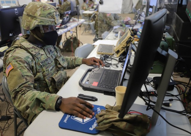 GRAFENWOEHR, Germany – Sgt. Fernando Washington, from Birmingham, Alabama, works at V Corps' main command post during Warfighter 22-1 in Grafenwoehr, Germany, Oct. 4. The WFX 22-1 is V Corps' final certifying exercise in becoming the U.S. Army's fourth corps headquarters and America's forward deployed corps in Europe. (U.S. Army photos by Pfc. Devin Klecan/released)