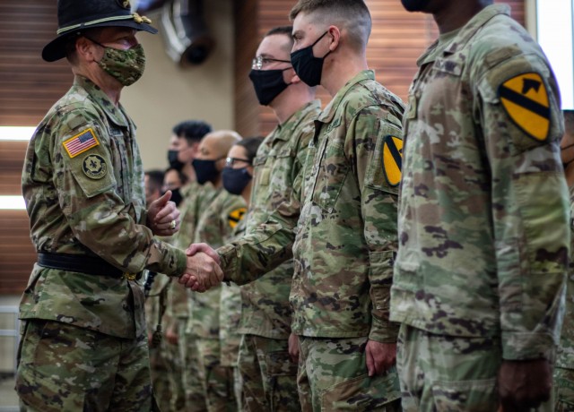 Maj. Gen. John Richardson, commanding general, 1st Cavalry Division, welcomes Troopers to the division during a patch ceremony Nov. 3 at the Mission Training Complex on Fort Hood, Texas. The Division recently inaugurated Pegasus Troop, a reception company, in an effort to integrate and welcome Troopers and their Families into the “First Team.” Nov. 3’s ceremony was the first of its kind where approximately 66 Troopers received a 1CD Patch formally joining America’s First Team.
