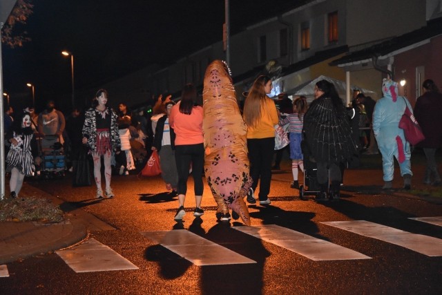 Children roam the streets of Newman Village in a variety of costumes searching for candy on Sunday, Oct. 31, 2021 on Clay Kaserne.