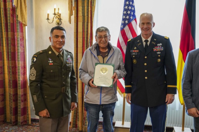 Command Sgt. Maj. Sebastian Camacho (left), Mr. Melvin Gonzales (center) and USAG Bavaria Garrison Commander Col. Christopher Danbeck (right) pose for a photo during the Length of Service award ceremony at the Tower View Conference Center in Tower Barracks on Oct. 15, 2021. (U.S. Army photo by Julian Temblador/ USAG Bavaria)