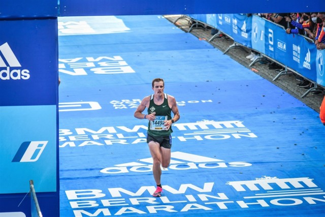 Capt. Connor Roche, a company commander assigned to the 2nd Battalion, 69th Armor Regiment, 2nd Armored Brigade Combat Team, 3rd Infantry Division, runs across the finish line at the Berlin Marathon in Berlin, Germany, Sept. 26, 2021. Roche ranked...