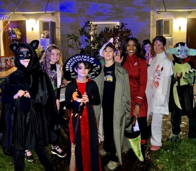 Local residents pose for a spooky smile as they trick-or-treat in the Aukamm housing area of USAG Wiesbaden Sunday Oct. 31, 2021