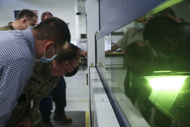 New employees attended a combination of virtual and in-person sessions, including a tour of the C5ISR Prototype Integration Facility, during the recent DEVCOM Mission Orientation. DMO participants are in the PIF fabrication area viewing a laser cutter.