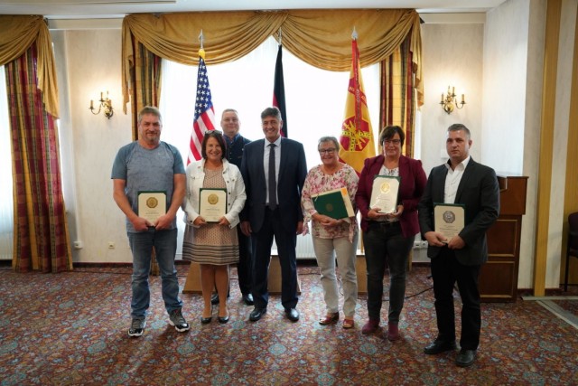 Grafenwoehr Mayor Edgar Knobloch (center) poses for a photo with Length of Service awardees during a ceremony at the Tower View Conference Center in Tower Barracks on Oct. 15, 2021. (U.S. Army photo by Julian Temblador/ USAG Bavaria)