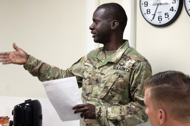 Staff Sgt. Bara Seck, an internal control analyst assigned to the Kaiserslautern, Germany, based 266th Finance Support Center, leads a training session on international money laundering at Camp Arifjan, Kuwait, Oct. 16, 2021. The 266th FISC was selected to pilot the introduction of counter threat finance techniques into the Army’s conventional forces. Soldiers assigned to the 266th FISC create financial profiles, perform suspicious activity report reviews, conduct commodity flow analyses and execute financial document exploitation—tasks that provide commanders with a greater understanding of the financial underpinnings of adversarial groups.
