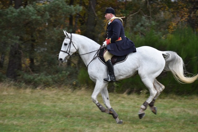 A member of a hunting party rides alongside the airstrip at Army Prepositioned Stock (APS-2) Site Zutendaal Oct. 31, 2021 near the Belgian Limburg towns of Wiemesmeer and Zutendaal. The hunting party was taking part in the towns' 50th anniversary...