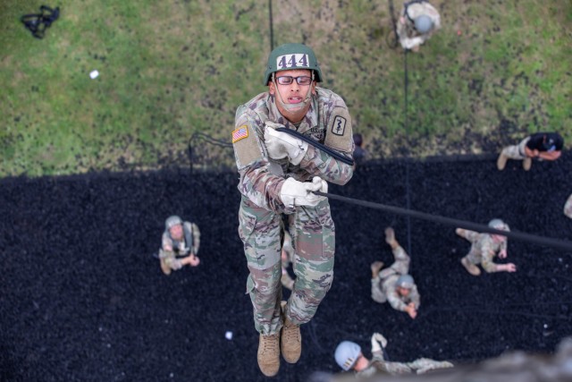 U.S. Army Sgt. Johan Villamil Novoa, 30th Medical Brigade medical logistics NCO, rappels off of the 60 foot rappel tower on Grafenwoehr Training Area, Sept. 15, 2021. The Army National Guard Warrior Training Center coordinated with the 7th Army Training Command's Combined Arms Training Center to host Air Assault School for approximately 270 students from Sept. 8 to 19, 2021. (U.S. Army Photo by Pfc. Jacob Bradford)
