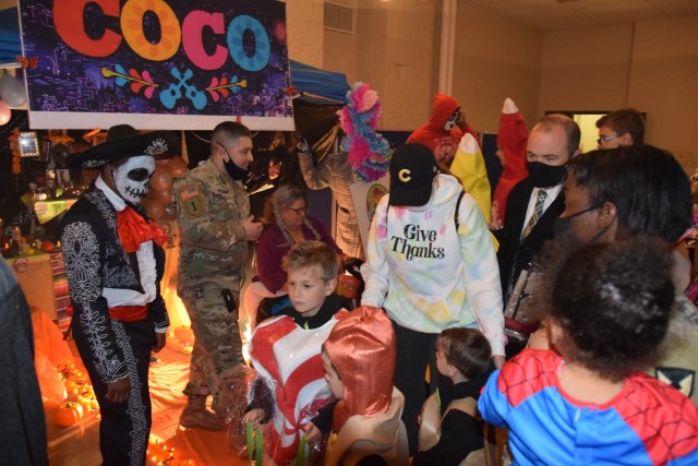 Members of U.S. Army Sustainment Command (G4 – Facilities and Logistics) give out candy at the Boo on the Rock / Truck or Treat celebration held Oct. 28 in Heritage Hall and the Lock & Lounge area on Rock Island Arsenal. The command earned...