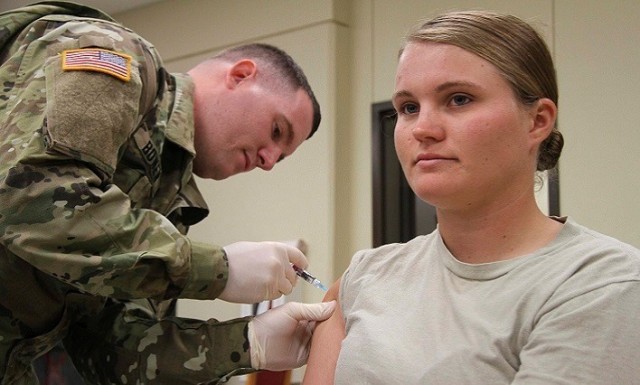 A Soldier receives her annual flu shot. Experts say flu season goes from October to March each year, and vaccines are responsible for a 40% reduction in illness severity.