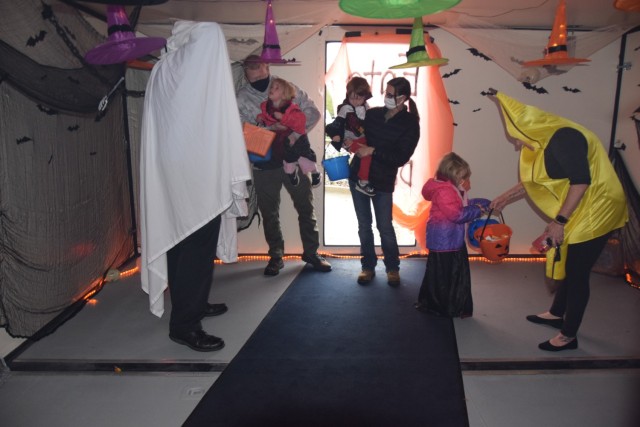 Rock Island Arsenal workforce family members make their way through the &#34;haunted house&#34; part of the Boo on the Rock / Truck or Treat celebration held Oct. 28 in Heritage Hall and the Lock & Lounge area on Rock Island Arsenal.