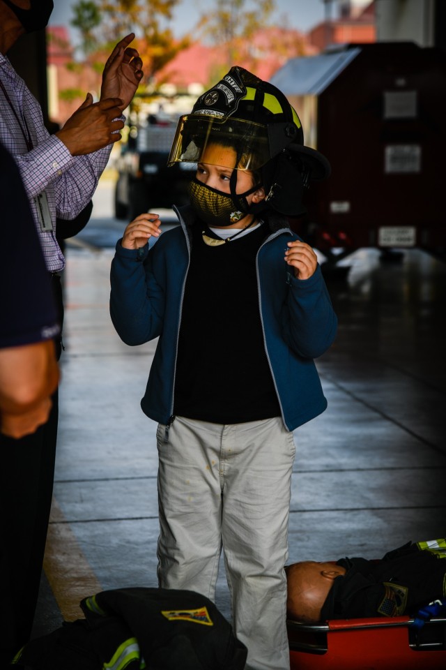 Emmett Manibusan, a student at Humphreys Middle School, tries on a firemen’s hat as part of the hands-on experience during the Learning Impaired Moderate to Severe program’s trip to Fire Station 4 on Camp Humphreys, South Korea, Nov. 1, 2021....