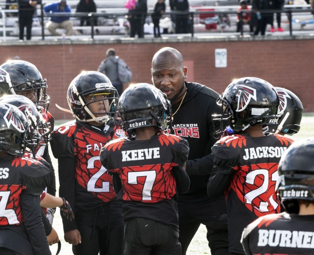 Darius Lane, Fort Jackson Falcons head coach and post Youth Services Sports Coordinator, gives his team a pep  talk during a time out during the 2021 Pop Warner State Championship Game at River Bluff High School in Lexington, S.C. Oct. 30. The Falcons won the game 32-0.
