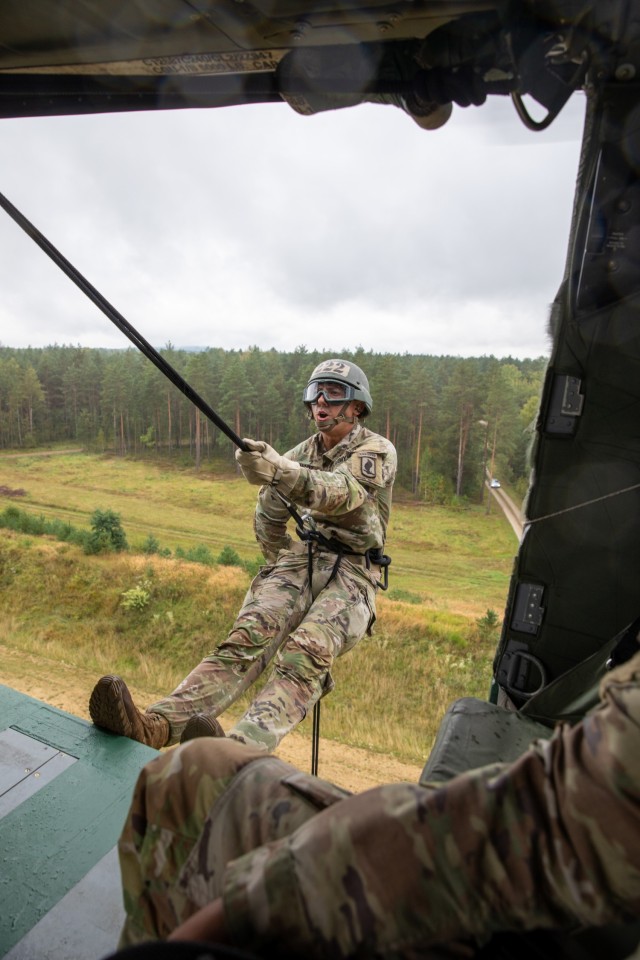 U.S. Army Soldier rappels from a UH-60M Black Hawk helicopter provided by the 12th Combat Aviation Brigade on Grafenwoehr Training Area, Sept. 16, 2021. The Army National Guard Warrior Training Center coordinated with the 7th Army Training Command's Combined Arms Training Center to host Air Assault School for approximately 270 students from Sept. 8 to 19, 2021. (U.S. Army Photo by Pfc. Jacob Bradford)