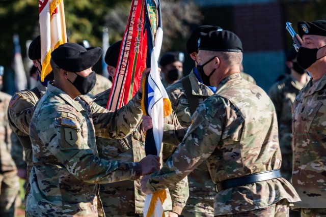 FORT KNOX, Ky. (Nov. 4, 2021) – V Corps Commanding General Lt. Gen. John Kolasheski passes the colors to the incoming V Corps Command Sgt. Maj. Raymond Harris during a change of responsibility ceremony at the V Corps Headquarters at Fort Knox, Kentucky, Nov. 4. During the ceremony, outgoing Command Sgt. Maj. Billy Webb relinquished responsibility as the V Corps senior enlisted leader to Harris. (U.S. Army photo by Renee Rhodes/released)