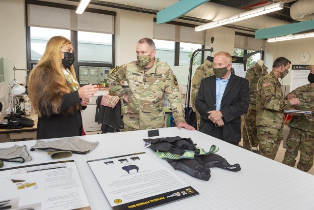 Gen. John M. Murray, Commanding General of U.S. Army Futures Command (AFC), receives a hands-on update of Organizational Clothing and Individual Equipment program, including the Female IOTV, the Physical Fitness Bra, the Female Urinary Diversion Device, or FUDD, and the Improved Hot Weather Combat Uniform – Female, or IHWCU-F, during a visit to the U.S. Army Combat Capabilities Development Command (DEVCOM) Soldier Center in Natick, Massachusetts on October 26, 2021.