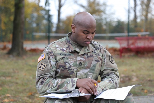 Staff Sgt. Paul Kariuki, the NCO in charge of the Landstuhl Regional Medical Center’s Family Medicine Clinic, completes the written exam portion of the Fiscal Year 2022 30th Medical Brigade and Regional Health Command Europe Best Medic Competition conducted Oct. 30 at Sembach Kaserne, Germany.