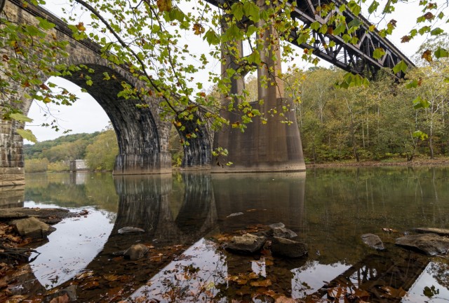 A view of the stone arch overpass and a railroad track crossing over the Conemaugh River downstream from the lake’s dam in Saltsburg, Pennsylvania, Oct. 22, 2021. The Conemaugh River Lake and the Loyalhanna Lake dams, managed by the U.S. Army...