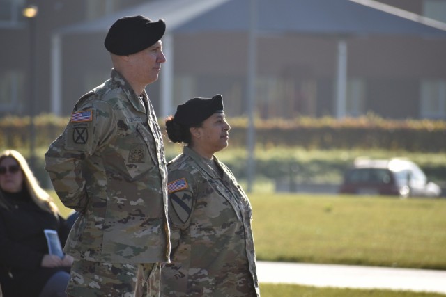 After officially changing responsibility, Command Sgt. Maj. Gary E. Yurgans, left, U.S. Army Garrison Benelux command sergeant major, stands with Command Sgt. Maj. Katrina M. Herzfeld, the garrison's outgoing command sergeant major, at the...
