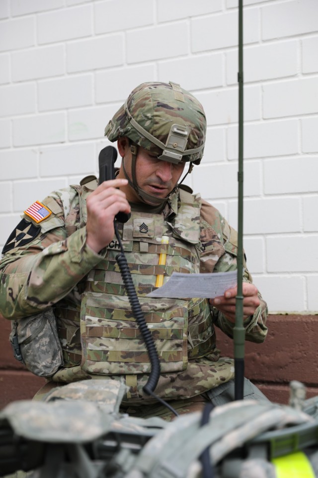 Staff Sgt. Timothy Rebich, a respiratory therapist assigned to Landstuhl Regional Medical Center, simulates calling in casualty evacuation support on a field mobile radio for a simulated combat casualty during the Fiscal Year 2022 30th Medical Brigade and Regional Health Command Europe Best Medic Competition conducted Oct. 30 at Sembach Kaserne, Germany.