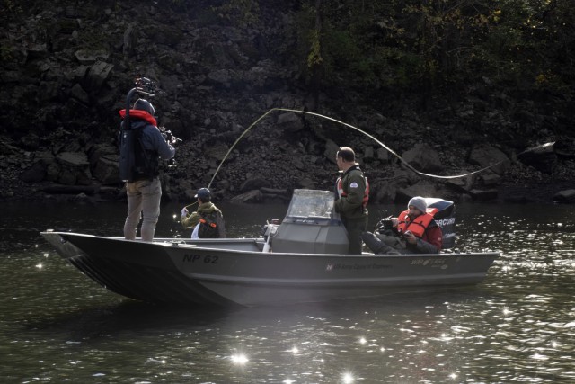 Park Ranger Gary Bruce maneuvers a Corps of Engineers boat into position Nov. 2, 2021 to allow an Open Jaw Productions film crew to obtain imagery of Phillip Sliger fly fishing in the Caney Fork River below Center Hill Dam in Lancaster, Tennessee....