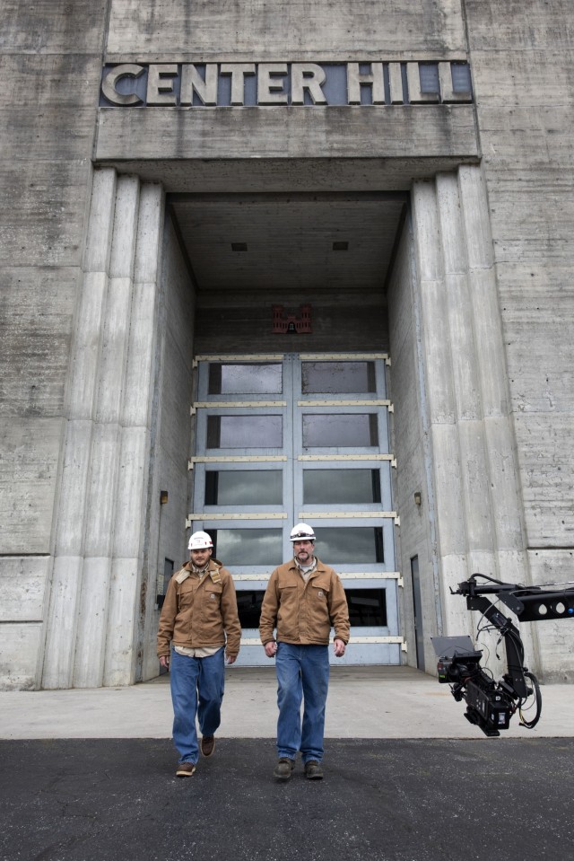 Senior Electrician Ron Gatlin (Right) and Electrician Kyle Mosakowski are captured on video Nov. 2, 2021 departing the Center Hill Dam Hydropower Plant in Lancaster, Tennessee, for a U.S. Army Corps of Engineers National Inventory of Dams video production. The Nashville District operates and maintains the project on the Caney Fork River in Lancaster, Tennessee. (USACE Photo by Leon Roberts)