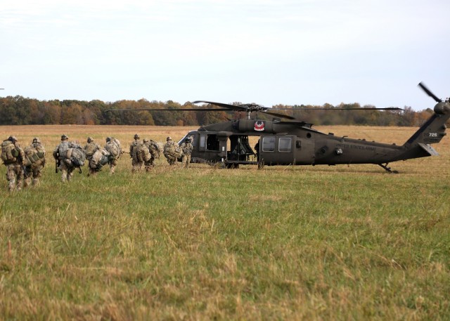 Soldiers with 1st Battalion, 327th Infantry Regiment, 1st Infantry Brigade Combat Team, 101st Airborne Division (Air Assault), load onto a UH-60 Blackhawk during training as part of Lethal Eagle, November 3, 2021, at Corregidor Drop Zone, Fort Campbell, KY.
