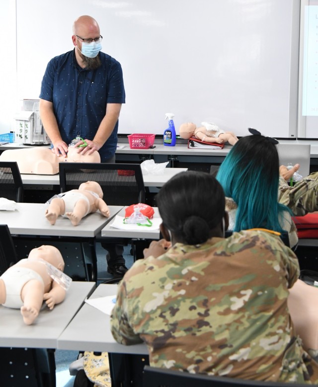 Tom Wojcikowski was among three certified instructors from the Fort Drum Soldier and Family Readiness Division, guiding participants through the free child and infant CPR course Nov. 4 at the Fort Drum Enrichment Center.  (Photo by Mike Strasser,...
