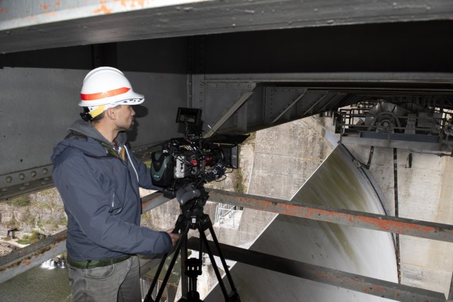 Director Zebediah Smith with Open Jaw Productions captures video of a spillway gate Nov. 3, 2021 at Center Hill Dam on the Caney Fork River in Lancaster, Tennessee, for a U.S. Army Corps of Engineers National Inventory of Dams video production. (USACE Photo by Leon Roberts)