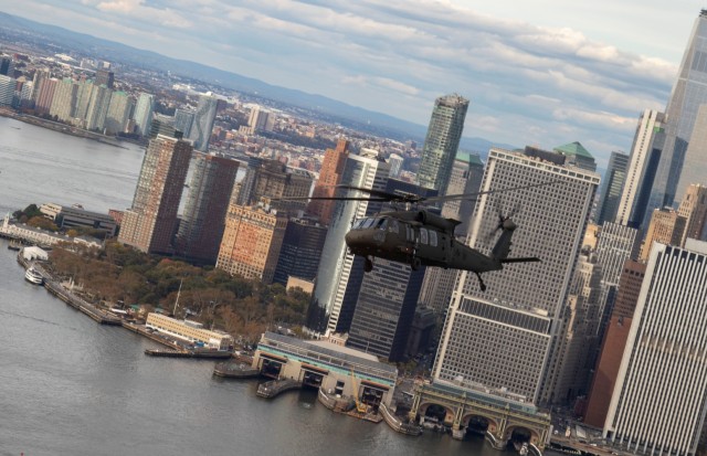 A New York Army National Guard UH-60 flies past lower Manhattan while carrying officers and noncommissioned officers taking part in the New York Army National Guard's Dense Urban Leaders Operations Course, to give participants a feel for the city's layout. The  5-day course is geared to train and educate staff officers and senior noncommissioned officers in the planning and execution of operations in complex urban environments.  (U.S. Army photo by Spc. Marla Ogden)