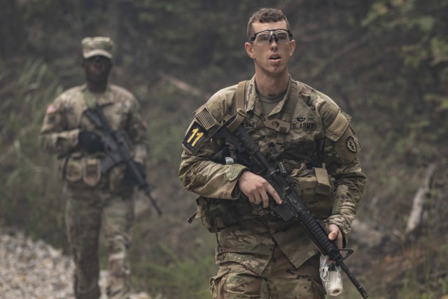Sgt. Adam Krauland, a cryptologic analyst of the U.S. Army Pacific Command, patrols an area during the Casualty Evacuation mission as part of the 2021 U.S. Army Best Warrior Competition, Oct. 4, 2021, at Fort Knox, Ky. The Best Warrior Competition challenges the U.S. Army’s top Soldiers and noncommissioned officers through a series of events including the Army Combat Fitness Test, weapons marksmanship, land navigation and a mystery event designed to push a Soldier’s skills, abilities, Army knowledge as well their physical and mental readiness to the limit. (U.S. Army photo by Sgt. Roger Houghton/177th Armored Brigade Public Affairs)
