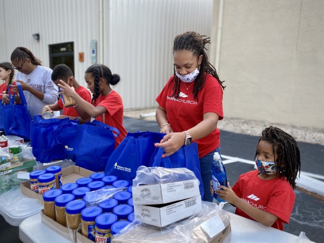 Volunteers pack bags with food to be distributed during the Military Family Advisory Network’s 1 million meal challenge at Manna Church, Oct. 23, 2021.  (U.S. Army Reserve photo by Sgt. 1st Class Javier Orona)
